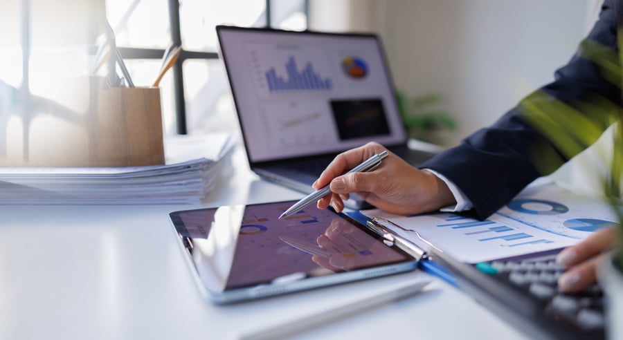 A person looking at business credit risk files in an office