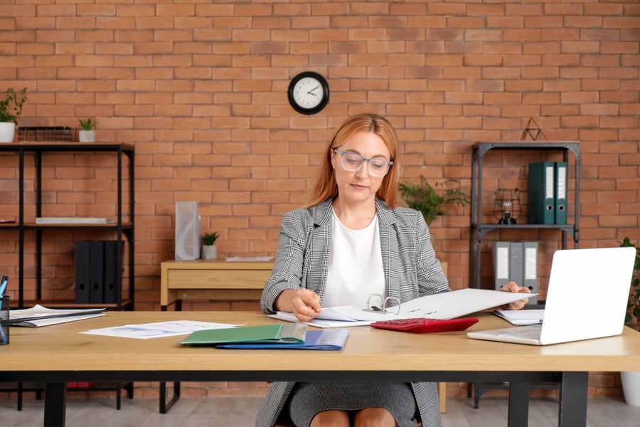 A woman looking at company payment data